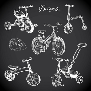 粉笔板镶手绘制的自行车和平衡自行车 安全帽