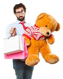 玩具熊和购物袋的人