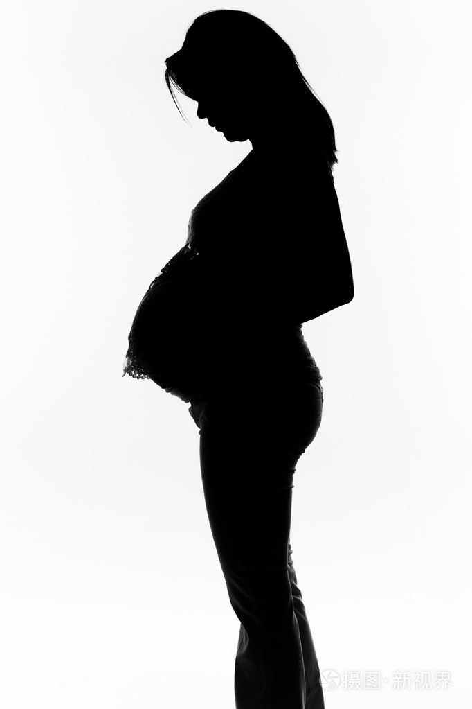 一个怀孕的女人的剪影照片-正版商用图片1nngfw-摄图新视界