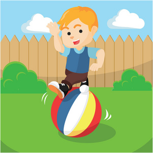 滚动球的男孩照片