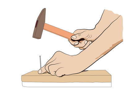 男人手用锤子和钉子是照片