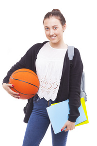 女学生拿着笔记本和一个篮球图片