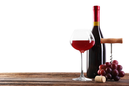 葡萄酒及葡萄光背景木制的桌子上