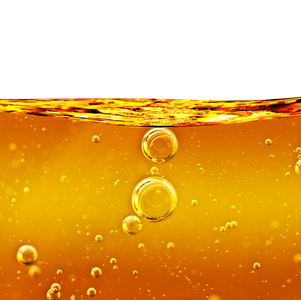 黄色石油石油背景黄色液体,有气泡照片