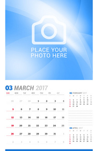 2017 年 3 月。墙体为 2017 年的月历。矢量设计打印模板与照片的地方。周从星期日开始。在页上的 3 个月。计划模板。文