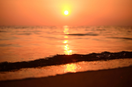 模糊与景太阳光波抽象背景热带日落海滩。旅游概念