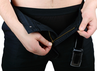 男人的手解开他们的裤子他飞照片