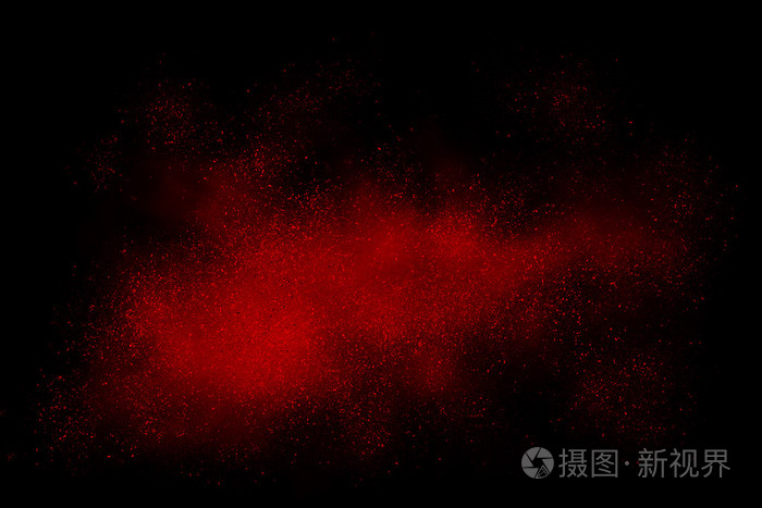 在黑色背景上的红色抽象粉末爆炸