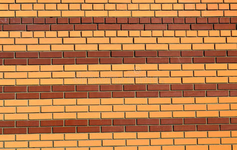 砖墙漆成棕色和黄色背景的条纹