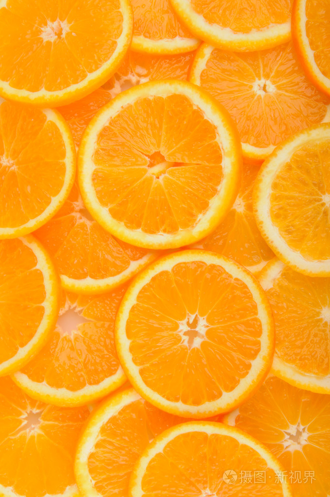 柑橘的背景多汁的桔子片覆盖整个表面