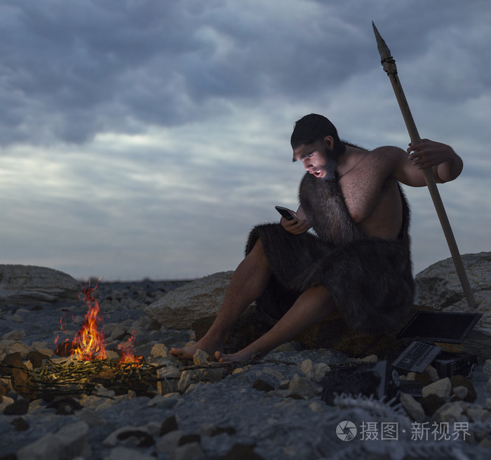 选址在智能手机概念图与石头上的原始人