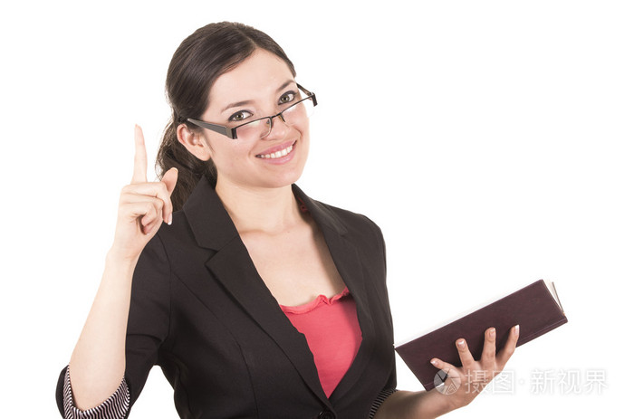 漂亮女老师戴着眼镜,拿着本书的肖像