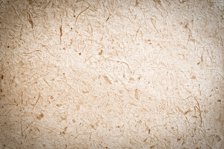 桑纸桑树纸纹理背景 / 关闭了棕色的桑皮纸与木浆背景照片