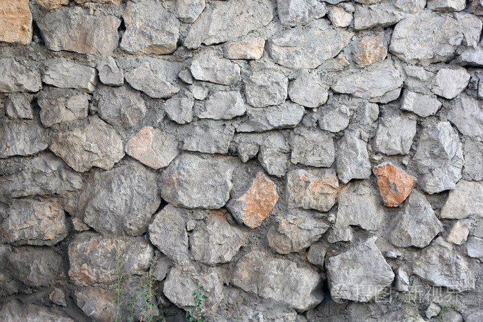 石砌体墙从老破旧破旧瓦砾前景