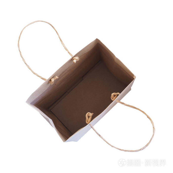 顶视图的分离在白色背景上的空棕色购物袋