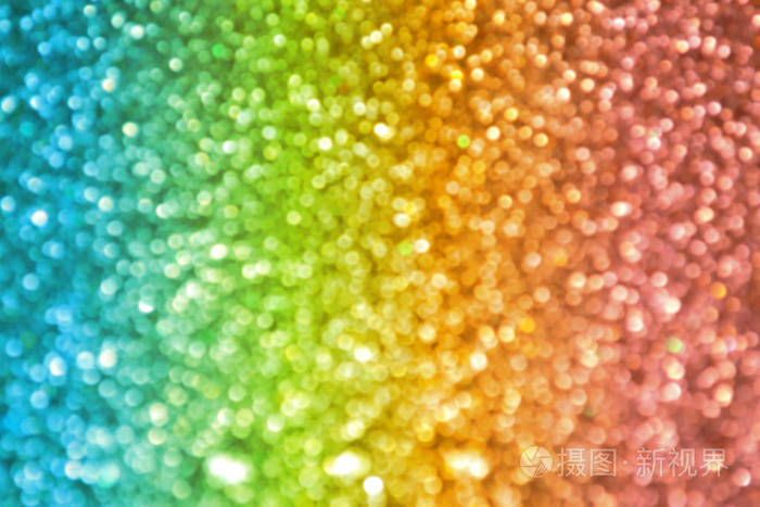 闪闪发光的明亮和抽象模糊七彩的虹背景闪光