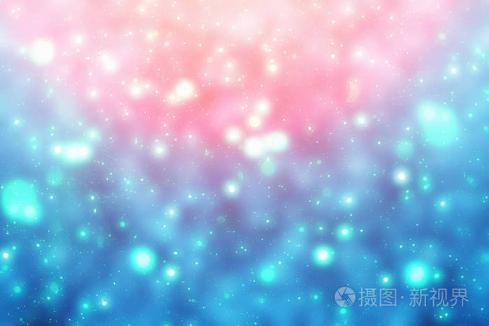 圣诞节景闪闪发亮的蓝色背景光.圆的散焦的颗粒