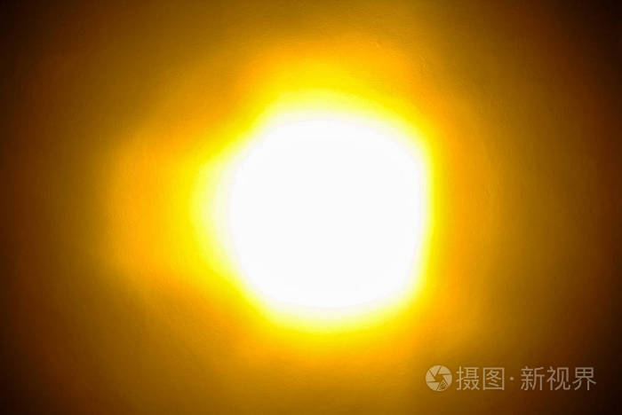 明亮的发光光背景与黄色和橙色光晕