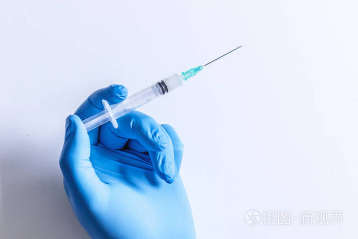 医用手套处置药物针头注射器药物概念流感疫苗小瓶剂量皮下注射治疗