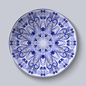 蓝色艺术盘子盘子上的蓝色花纹. 中国瓷画的特点.照片