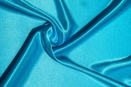 豪华面料或液体波或波浪皱褶丝绸缎纹的抽象背景,天鹅绒材料或豪华