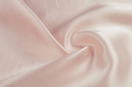 纹理布是淡粉色的丝绸. 心情是一种干净的,轻盈的织物.