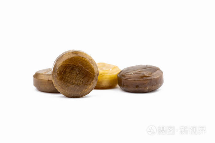 中草药糖果.棕色和黄色的锭剂.咳嗽滴.天地梅橙柠檬糖