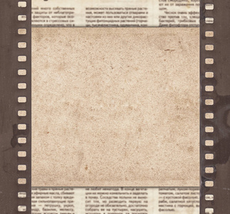 复古纸,报纸和旧电影带的复古背景照片