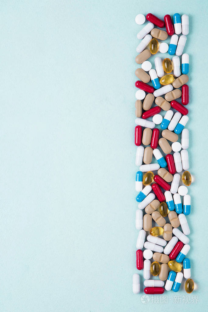 药物制剂的背景五颜六色的药物药片和胶囊分散医学概念