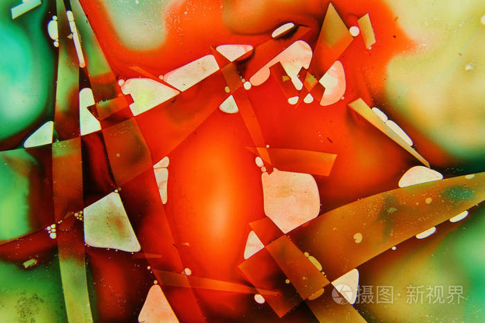 彩色液体混合在一起,形成五颜六色的抽象绘画