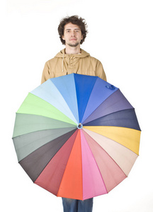 用彩色雨伞站立的人的肖像图片