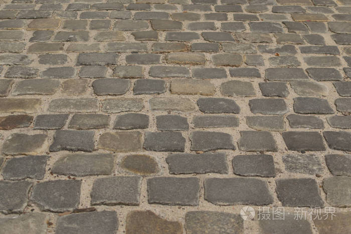 灰色旧路面顶部景观或花岗岩鹅卵石路.