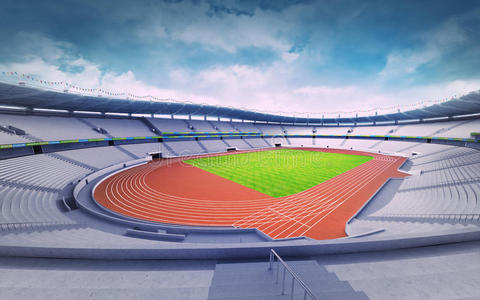 空的田径体育场,在拐角处有田径场和草地场照片