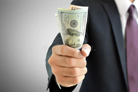抓钞票商人手抓钱,美元(美元)钞票照片