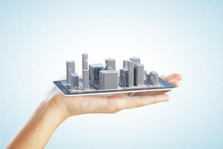 智能手机和人手上的3D城市建筑
