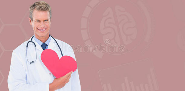 微笑男性医生手持心形卡的复合图像