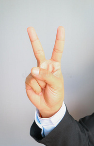 商人两个手指商人伸出两个手指的手照片