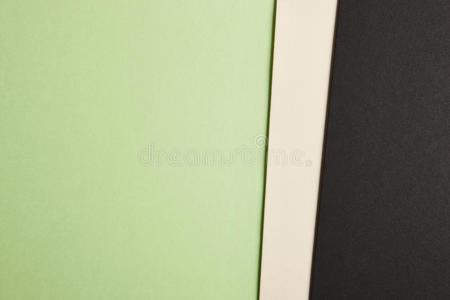 彩色纸板背景绿色米色黑色色调。 复制sp