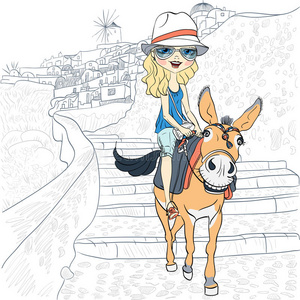 美丽的女孩骑驴在奥亚,桑托里尼照片