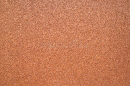 深棕色的粗糙砂纸的深棕色纹理照片