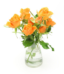 一束玫瑰放在玻璃瓶里照片