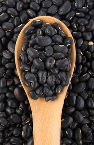 木头背景中的黑眼豌豆豆照片