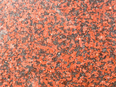 红色花岗岩抽象纹理背景的特写