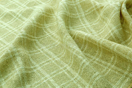 绿色背景豪华布或波浪褶皱的丝纹理缎绒