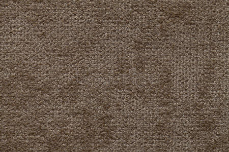 棕色背景的柔软，蓬松的布。 纺织品特写的纹理