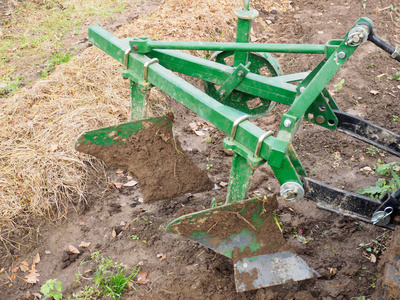 Plow of a small tractor for plowing the land. Preparing for the 