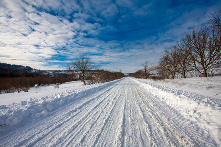 Empty snow covered road