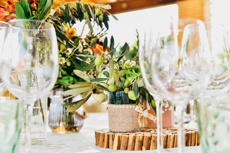 Empty glasses next to the cutlery and table linen of a guest tab