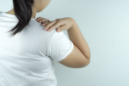 Woman handle the shoulder pain on white background. Health care 