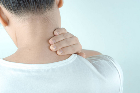 Closeup woman neck and shoulder feeling exhausted and suffering 